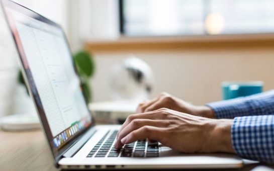 Person typing on a laptop