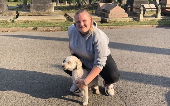 A woman and her dog in Paddington Old Cemetery