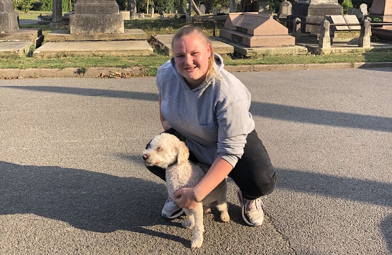 A woman and her dog in Paddington Old Cemetery