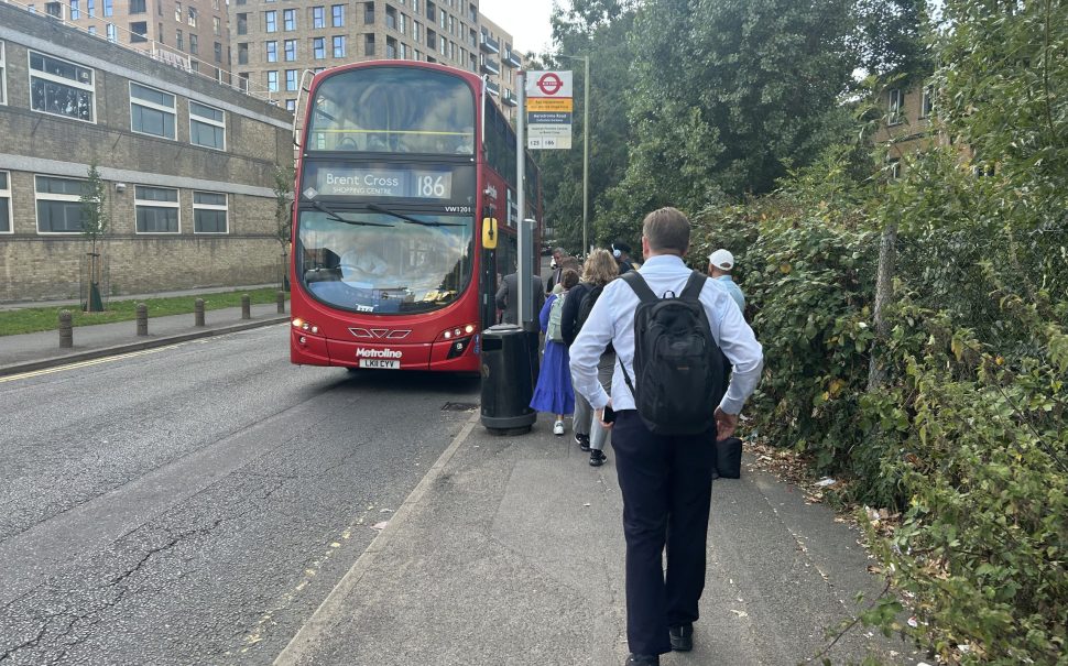 Passengers queue to board the 186 bus in Colindale