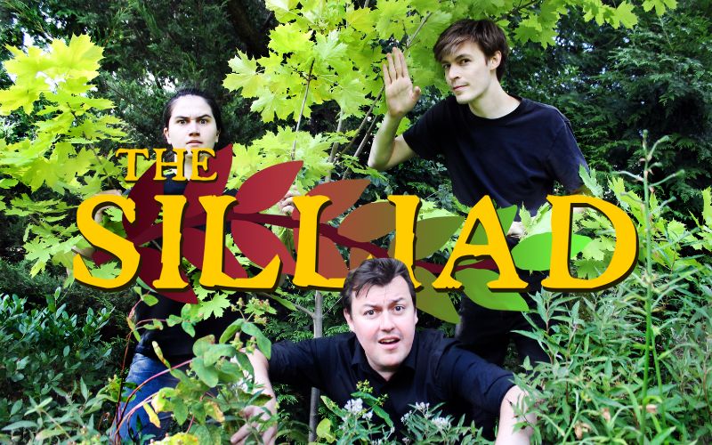 The three cast members in amongst some bushes, with 'The Silliad' digitally layered on top