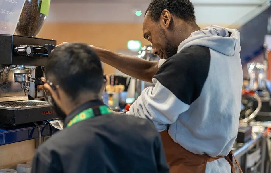 A barista making a hot drink