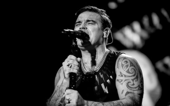 Robbie Williams in concert in black and white