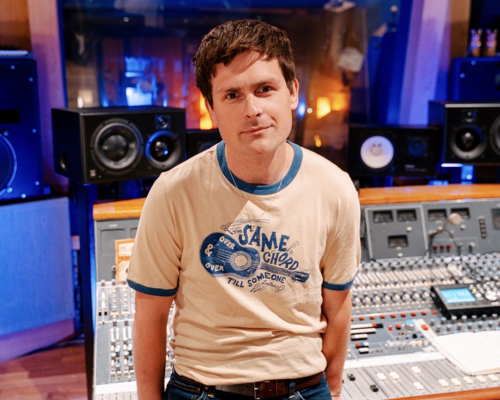 British musician Tom Speight in a recording studio making his album.